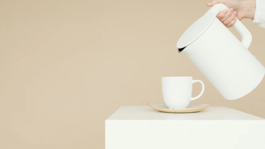 a person is pouring something into a cup, by Évariste Vital Luminais, minimalism, beige, kettle, thumbnail, scandinavian