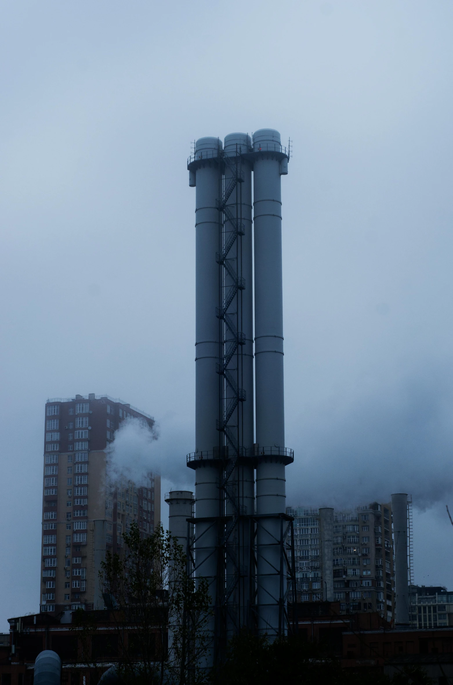 a factory with a lot of smoke coming out of it, by Attila Meszlenyi, brutalism, water pipe, three towers, 2 0 0 mm telephoto, neo kyiv