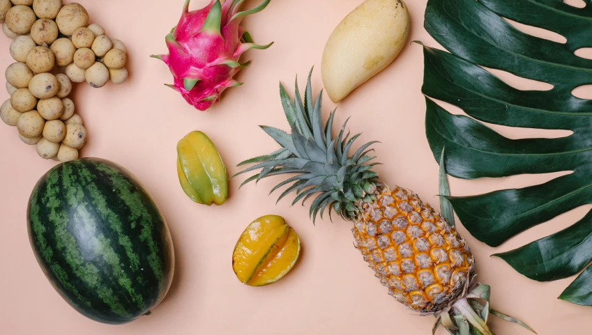 a variety of fruits and vegetables laid out on a pink surface, trending on unsplash, pineapples, 🦩🪐🐞👩🏻🦳, tropical leaves, background image