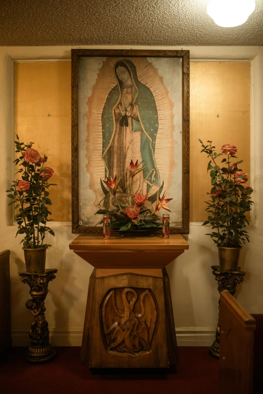 a painting of the virgin of guadalupe in a church, a statue, by Everett Warner, pexels, lamps and flowers, minimalist, square, iconostasis in the bar