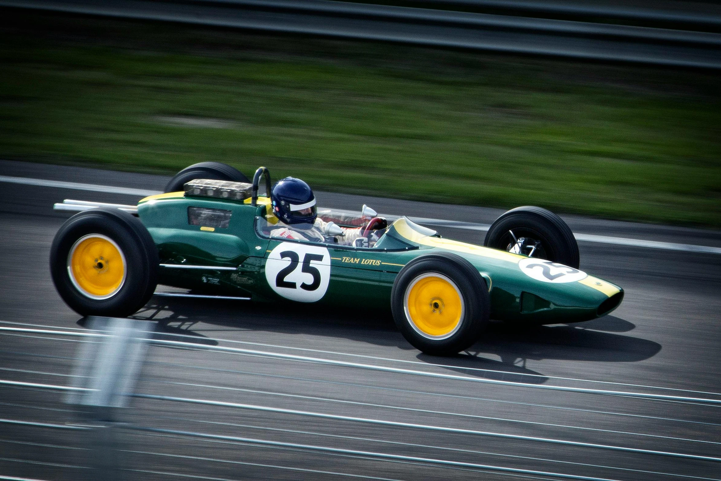 a green race car driving down a track, a portrait, pexels contest winner, midcentury modern, lotus, large format picture, 15081959 21121991 01012000 4k