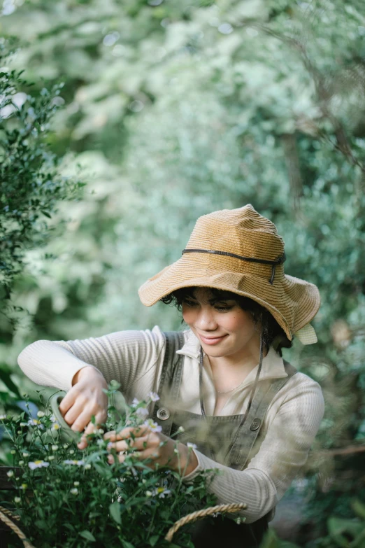 a woman in a hat working in a garden, unsplash, renaissance, manuka, wearing adventuring gear, avatar image, brown