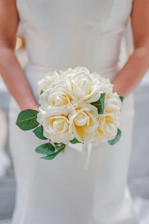 a woman in a wedding dress holding a bouquet of flowers, by Ruth Simpson, unsplash, mini model, white roses, fully photorealistic, evening sun