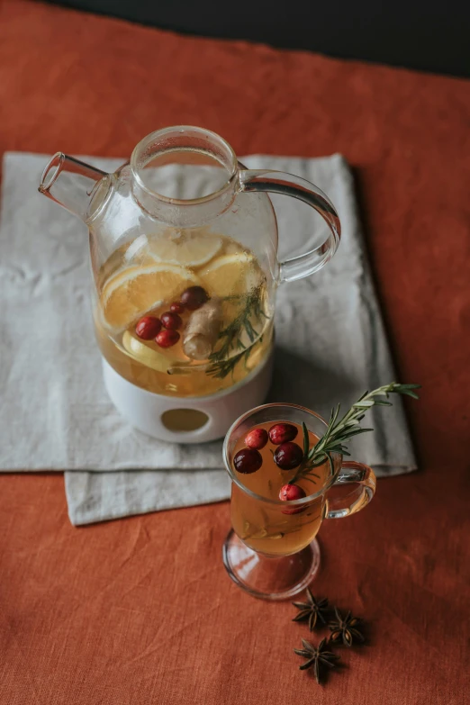 a pitcher filled with liquid sitting on top of a table, holiday vibe, square, thumbnail, citrinitas