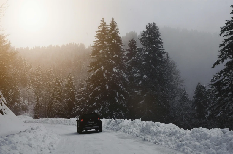 a truck driving down a snow covered road, by Thomas Häfner, pexels contest winner, romanticism, black forest, back, car, super high resolution