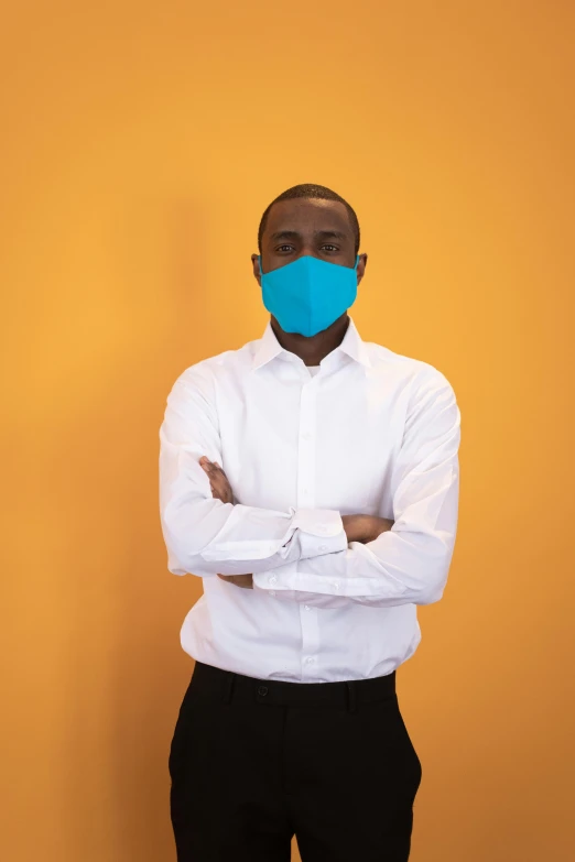 a man in a white shirt and a blue mask, by Gavin Hamilton, pexels, cyan and orange, mkbhd, frontal pose, single color