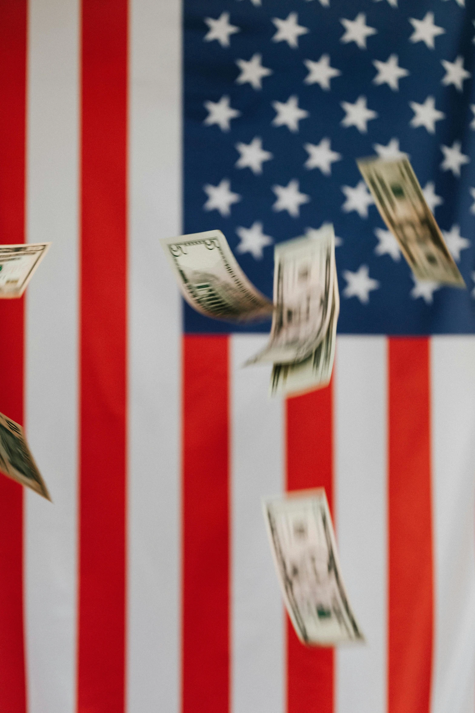 a bunch of money flying in the air in front of an american flag, pexels contest winner, conservative, instagram post, 3 2 k, 15081959 21121991 01012000 4k