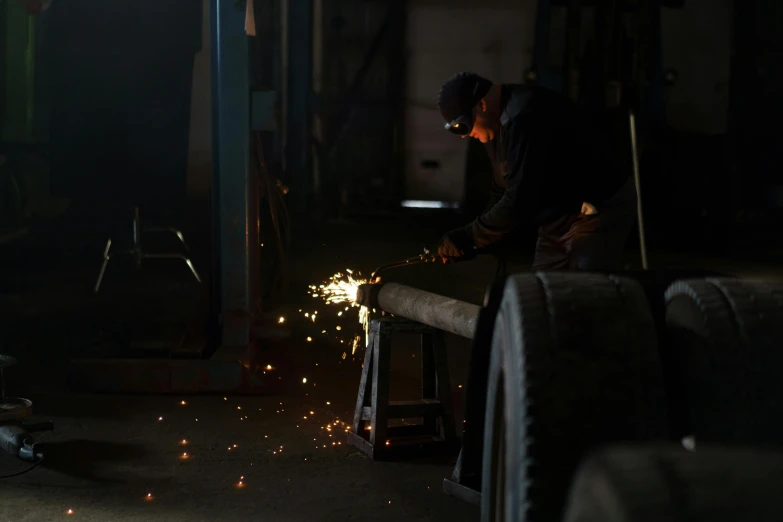 a man that is working on some kind of thing, by Attila Meszlenyi, pexels contest winner, auto-destructive art, welding torches for arms, thumbnail, photograph 3 5 mm, profile image