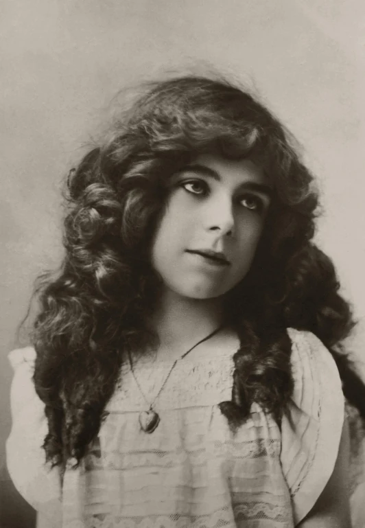 a black and white photo of a woman with long hair, a colorized photo, inspired by Violet Oakley, curly bangs, rebecca sugar, sargent and raffaelo monti, aged 13