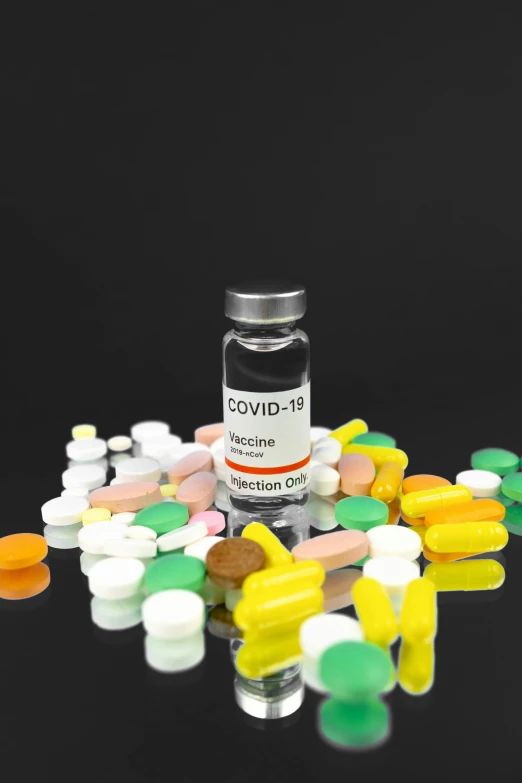 a bottle of covidid sitting on top of a pile of pills, a picture, multi - coloured, thumbnail, large)}], coronavirus