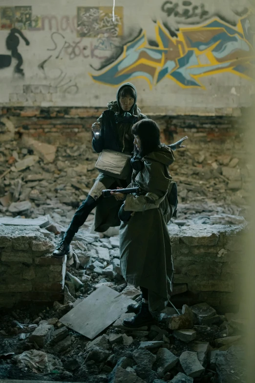 a couple of people standing on top of a pile of rubble, by Adam Marczyński, unsplash, conceptual art, 2 techwear women, carrying mosin on back, ( ( theatrical ) ), orthodox cyberpunk