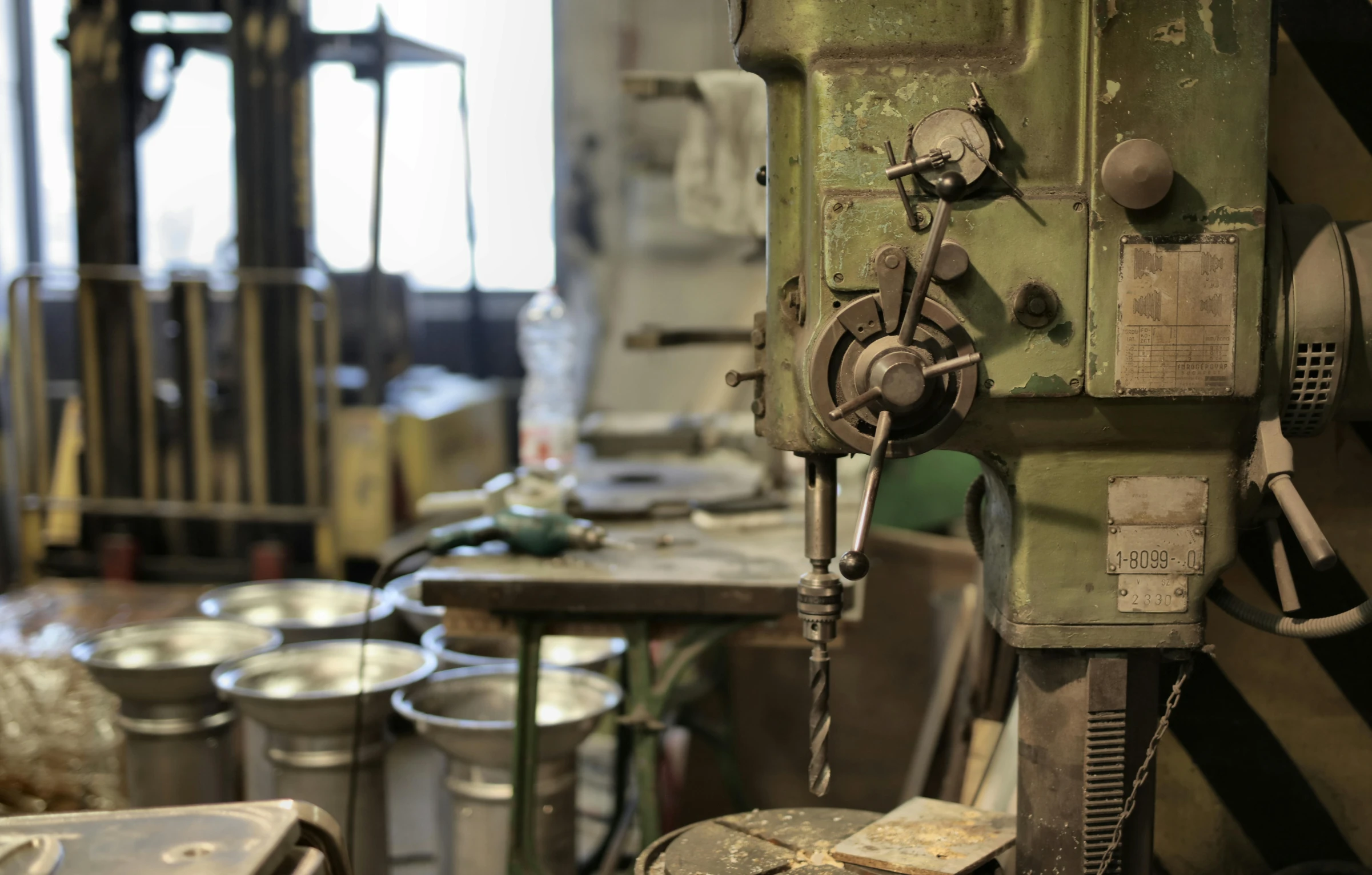 a machine that is sitting in a room, unsplash, arbeitsrat für kunst, scrap metal on workbenches, pistons and bolts, in a workshop, olan mills studio