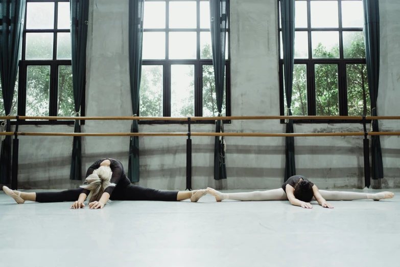 a couple of women laying on the floor next to each other, by Elizabeth Polunin, unsplash, arabesque, school class, animation, ignant, trio