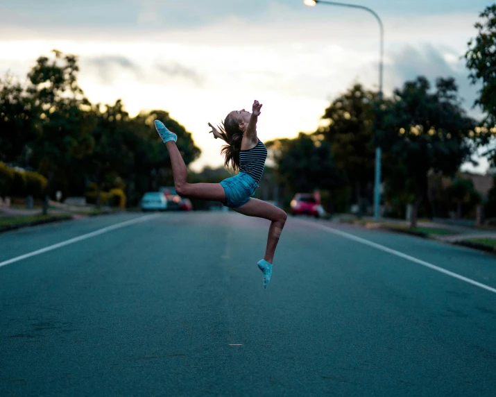 a girl jumping in the air in the middle of the road, pexels contest winner, arabesque, sydney hanson, square, profile picture, 15081959 21121991 01012000 4k