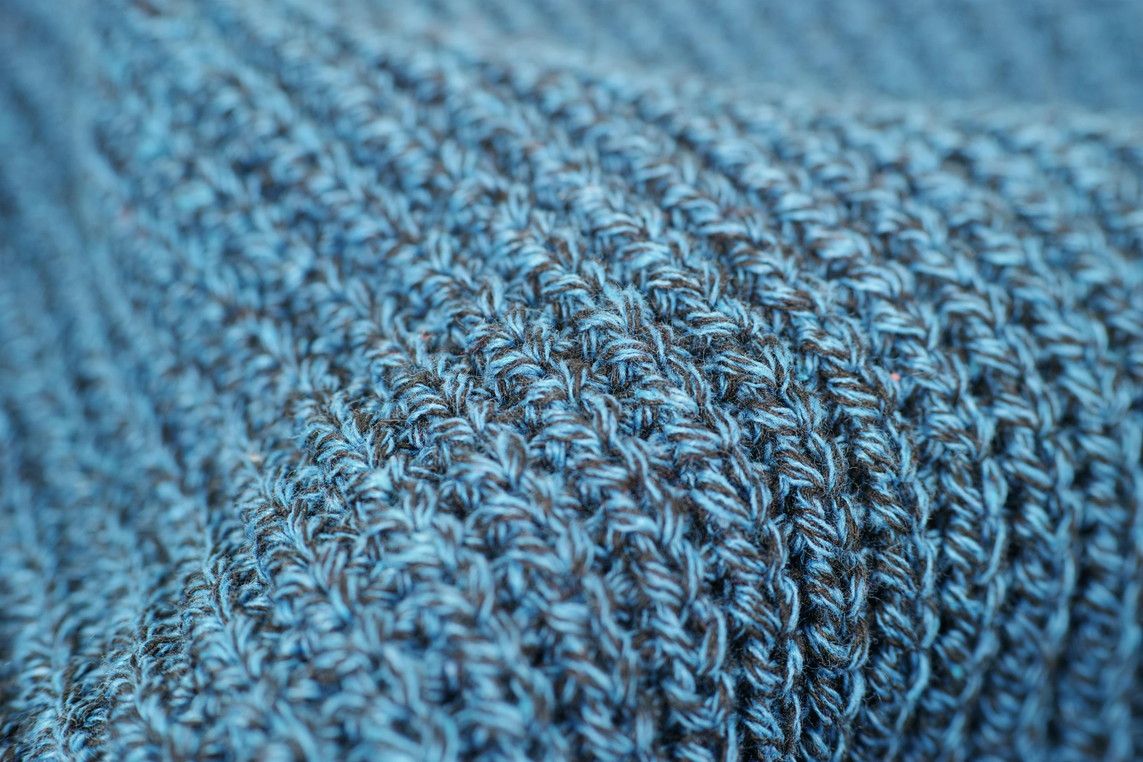 a close up of a blue knitted blanket, by Carey Morris, unsplash, highly detailed product photo, smart textiles, cowl, cotton fabric