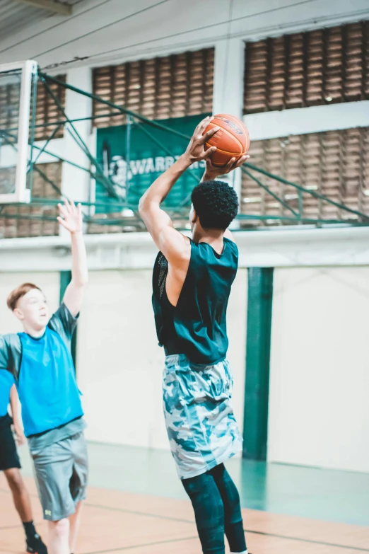 a group of young men playing a game of basketball, origin jumpworks, aged 13, highly upvoted, jaylen brown