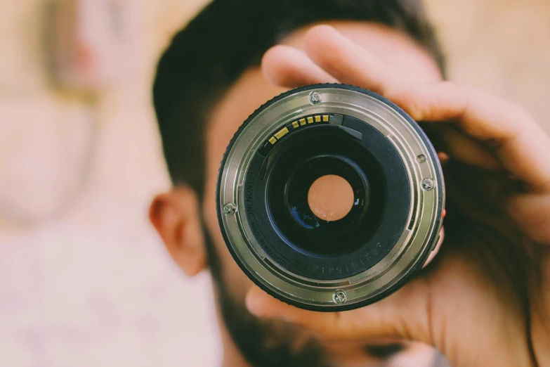 a man taking a picture with a camera, pexels contest winner, photorealism, lens zooming, unsplash 4k, headshot, telephoto