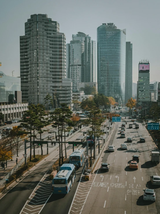 a street filled with lots of traffic next to tall buildings, by Jang Seung-eop, unsplash 4k, square, gif, school