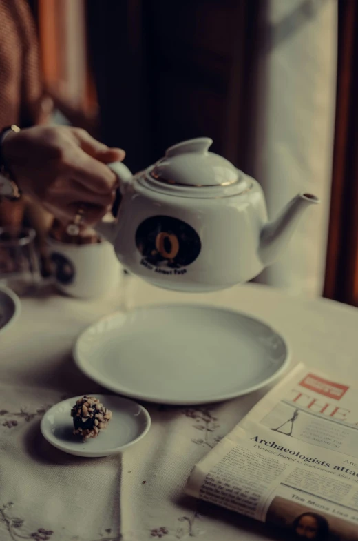 a person pouring tea into a cup on a table, by Julia Pishtar, pexels contest winner, renaissance, restaurant menu photo, from the grand budapest hotel, instagram story, white