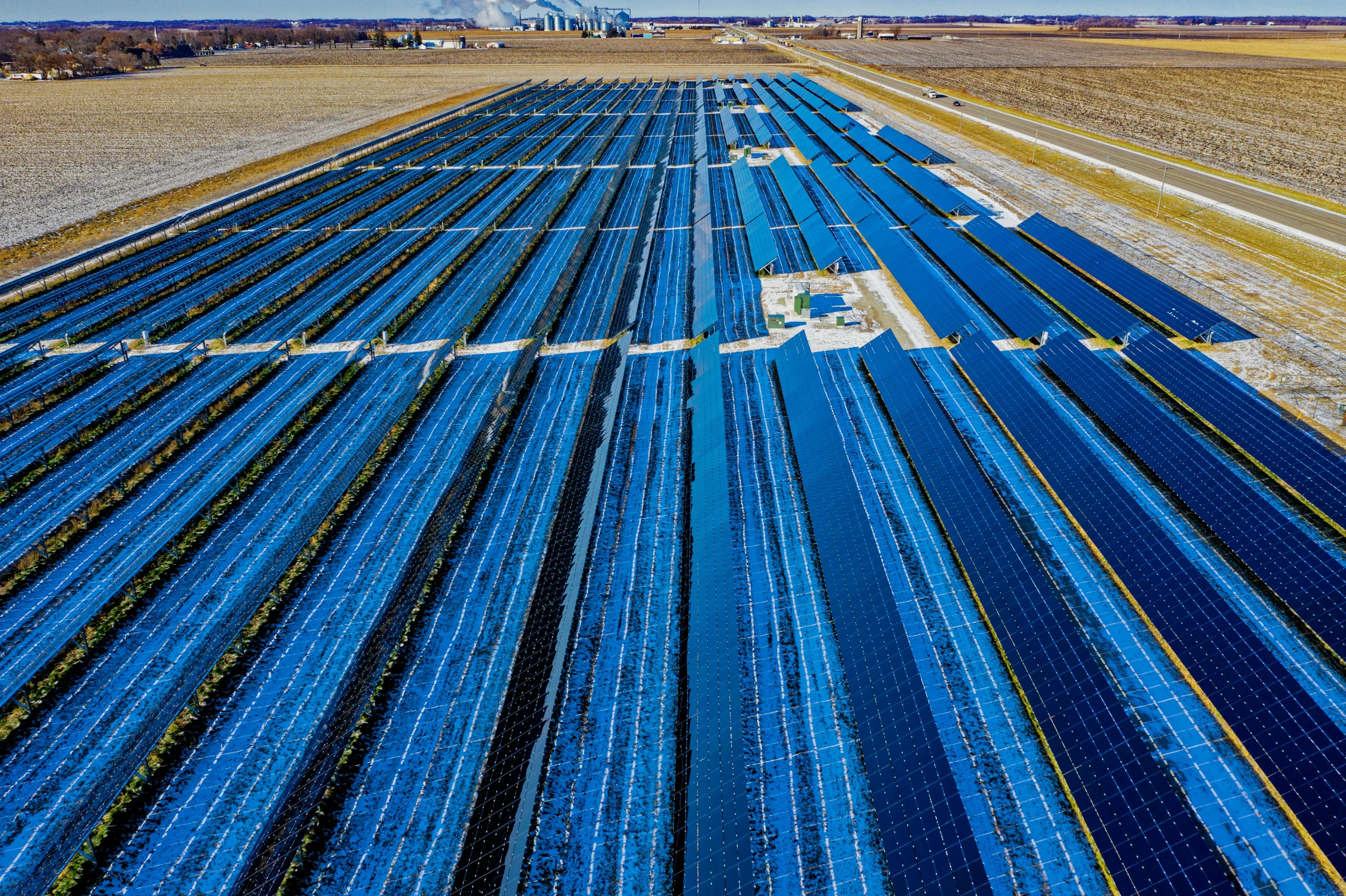 a large array of solar panels in a field, a portrait, by Daniel Schultz, lpoty, terminals, thick blue lines, viewed from bellow