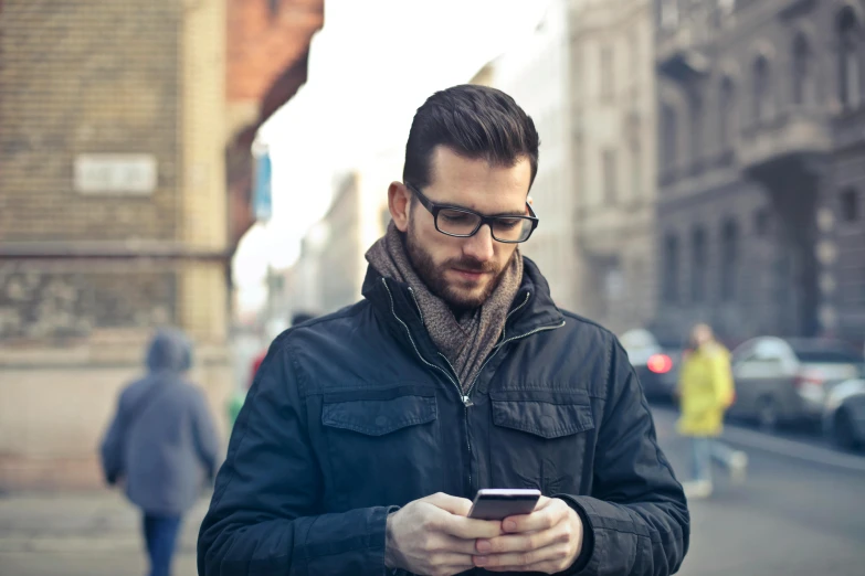 a man standing on a city street looking at his cell phone, pexels, renaissance, with glasses and goatee, square, romanian, australian