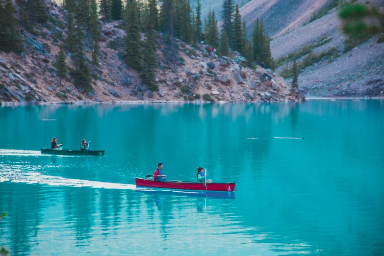 a couple of people in a boat on a lake, inspired by Wes Anderson, pexels contest winner, banff national park, red and cyan, fishing boats, avatar image