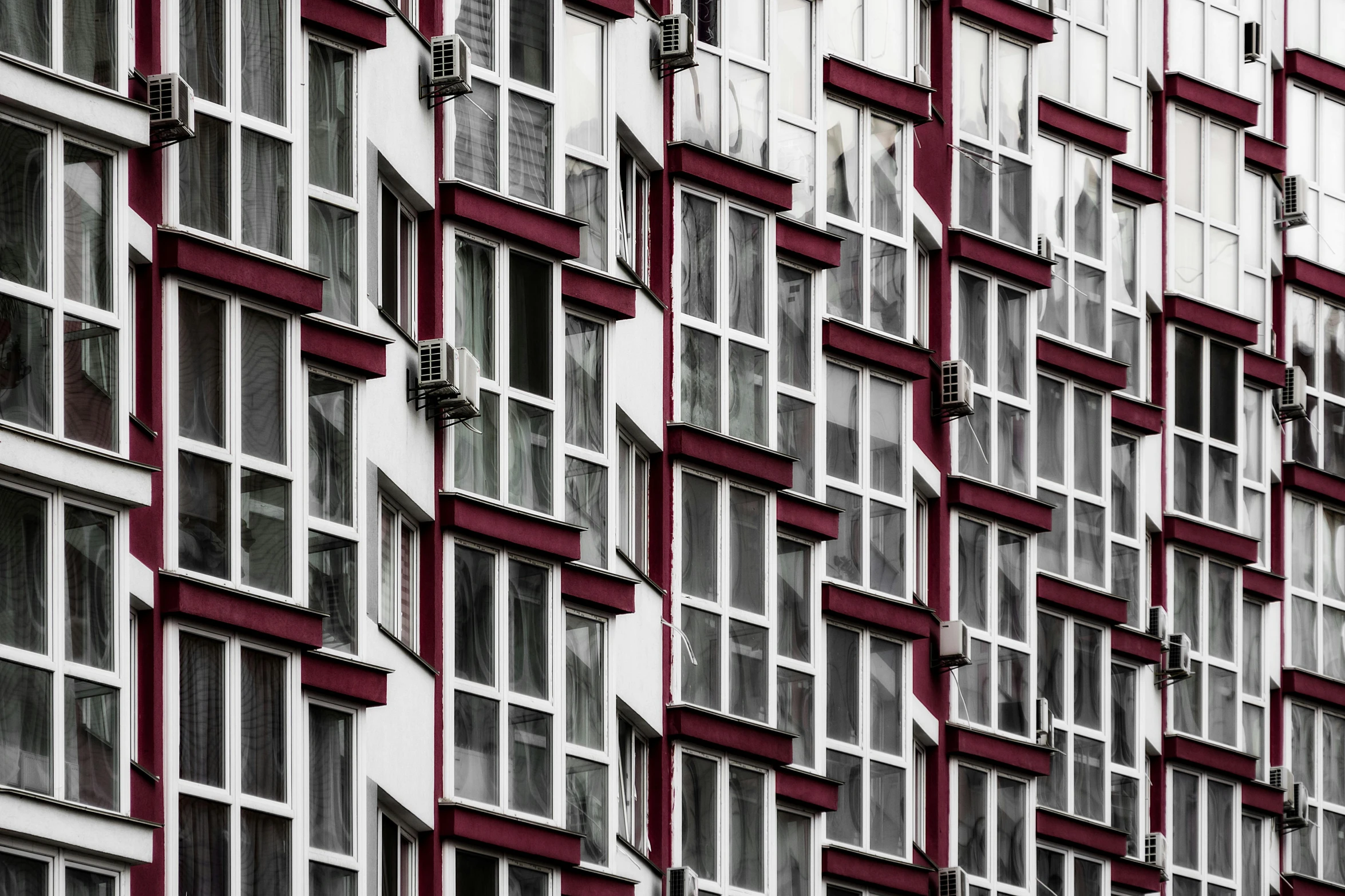 a red and white building with lots of windows, by Ihor Podolchak, urban photography, apartment with black walls, фото девушка курит, modular detailed