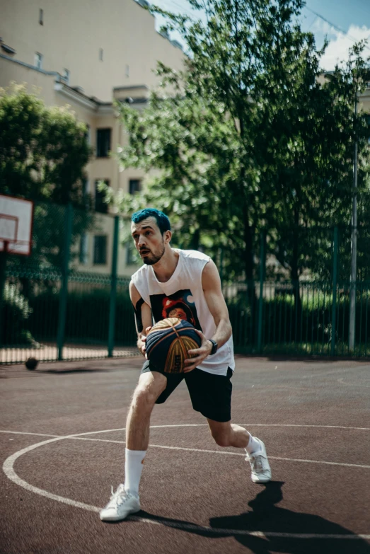 a man standing on a basketball court holding a basketball, by Adam Marczyński, dribble contest winner, wearing a tank top and shorts, hasbulla magomedov, focused photo, game ready