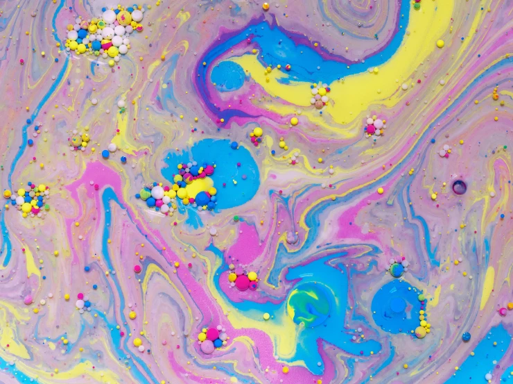 a close up of a colorful liquid painting, inspired by Tomokazu Matsuyama, candy pastel, inside a marble, in a lisa frank art style, galactic yellow violet colors