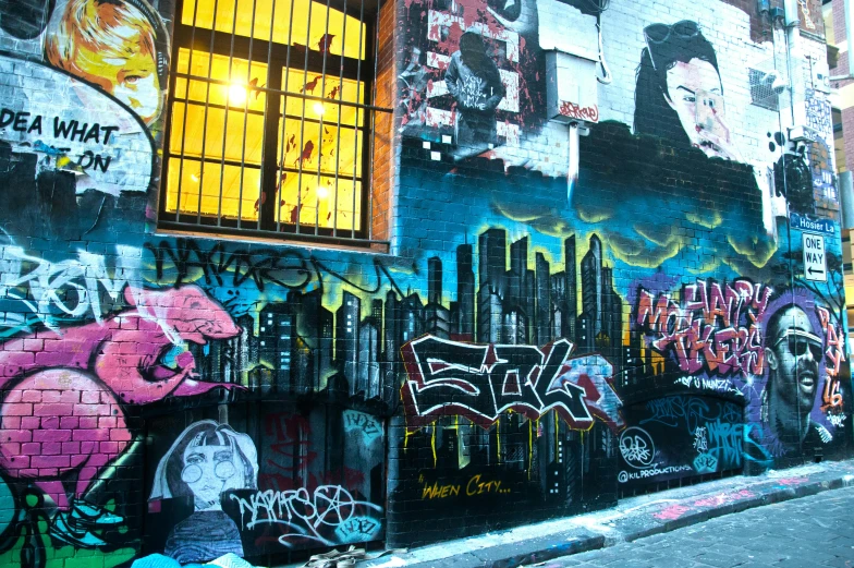 a wall covered in lots of graffiti next to a building, graffiti art, flickr, melbourne, gothic city streets behind her, night life, youtube thumbnail