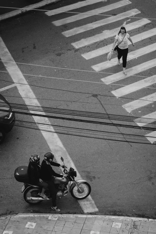 a black and white photo of a person on a motorcycle, by Giorgio Cavallon, pexels contest winner, crosswalks, telephone wires, square, two people