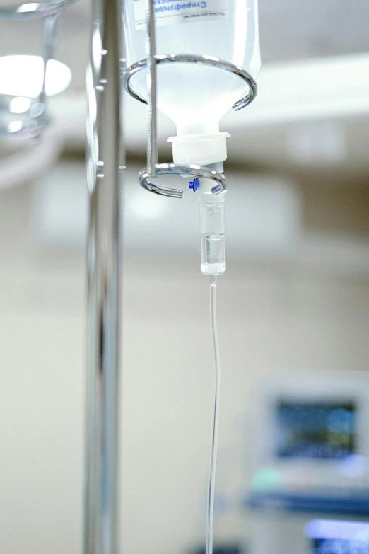 a close up of an ivg in a hospital room, fluids, single head, hanging, innovative