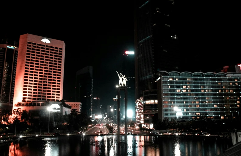 a black and white photo of a city at night, a picture, by Basuki Abdullah, pexels contest winner, hurufiyya, colored photo, square, low detailed, a phoenix