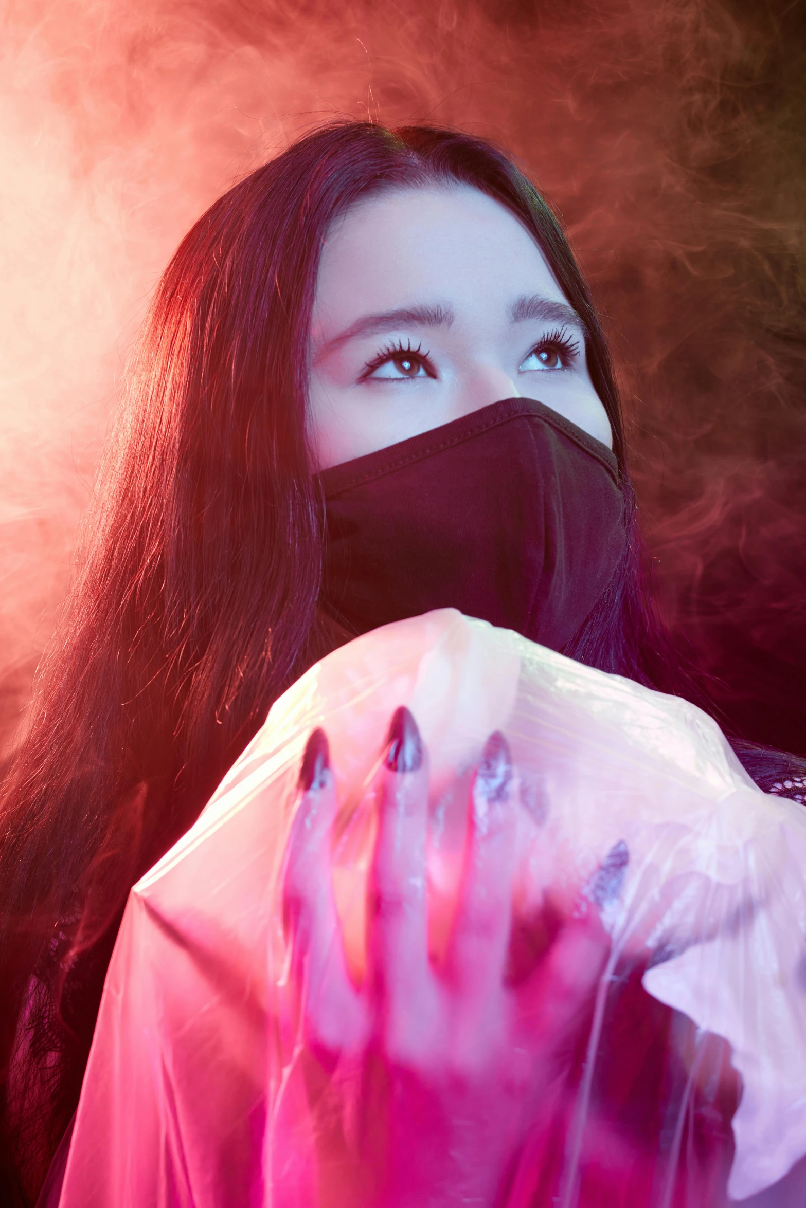 a close up of a person wearing a face mask, an album cover, inspired by Yanjun Cheng, trending on pexels, iu lee ji-eun as a super villain, glowing hands, techwear occultist, intense smoke