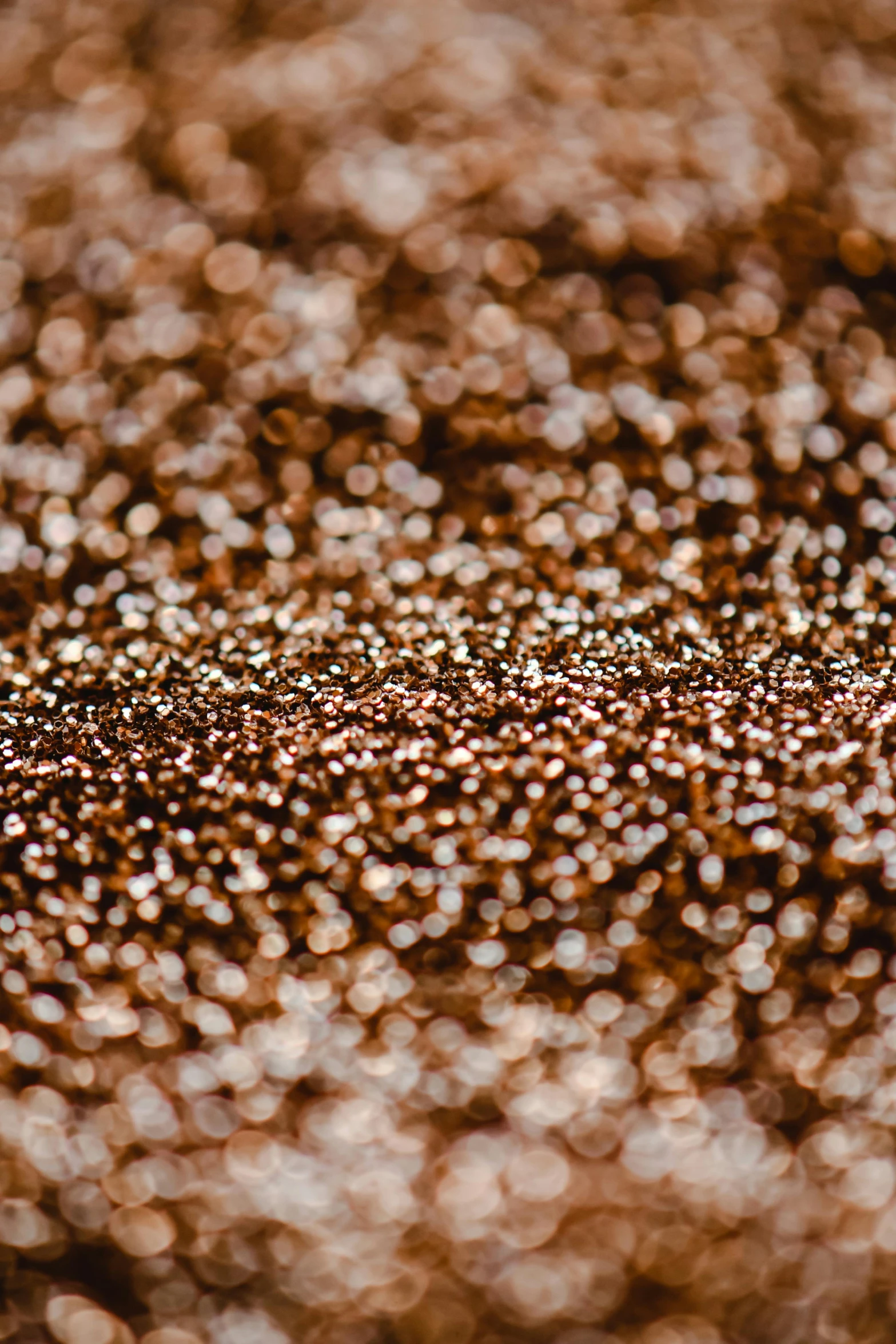 a piece of cake sitting on top of a table, a microscopic photo, by Attila Meszlenyi, trending on unsplash, pointillism, metallic bronze skin, made of liquid metal, detail shot, sparkling light