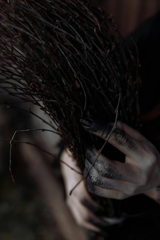 a close up of a person holding a broom, inspired by Nicola Samori, wild hairstyle, hands in her hair, fromsoftware, slide show