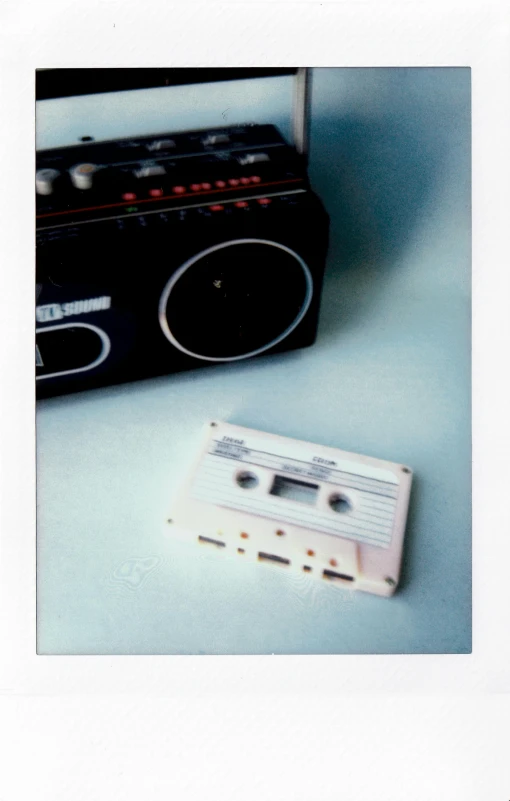 a cassette player and a radio sitting next to each other, a polaroid photo, by Pablo Rey, private press, ((still life)), msxotto, cassette tape, cinestill