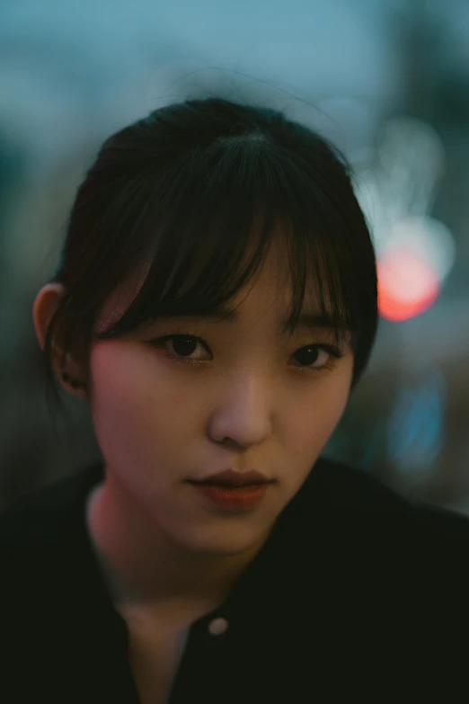 a close up of a person with a cell phone, a picture, inspired by Jung Park, pexels contest winner, realism, young adorable korean face, moody dim faint lighting, square face, teenage girl
