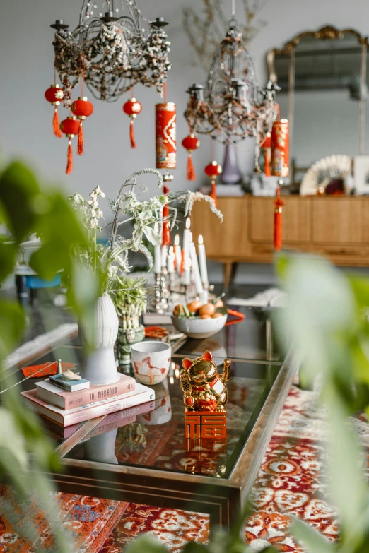 a living room filled with furniture and plants, maximalism, chinese new year in shanghai, long table, silver red white details, hanging