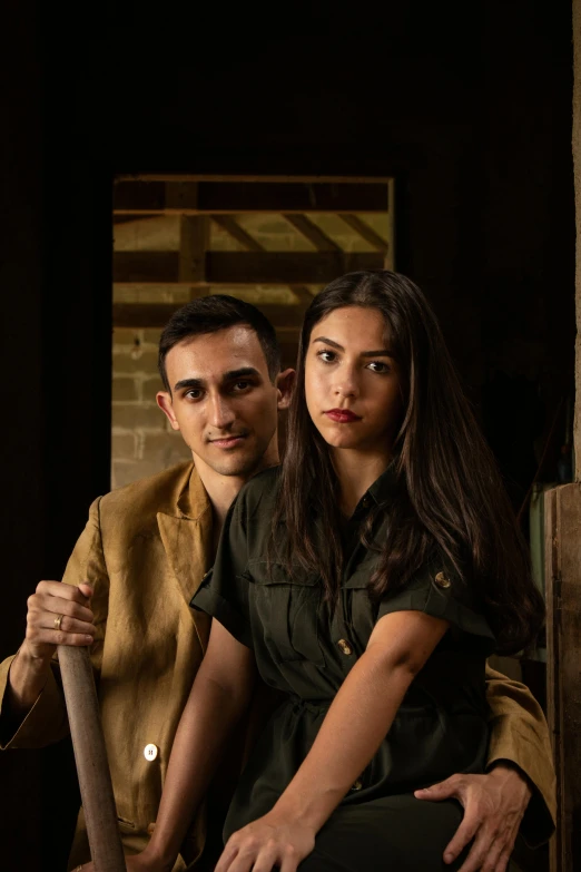 a man and a woman sitting next to each other, a portrait, inspired by Balthus, renaissance, weathered olive skin, promotional image, battle ready, world war 2 portrait photo