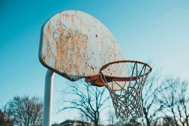 a close up of a basketball hoop with a blue sky in the background, by Matija Jama, pexels contest winner, well worn, playground, 15081959 21121991 01012000 4k, instagram post