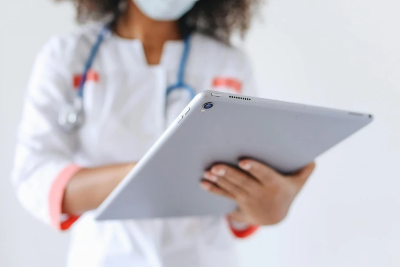 a close up of a person holding a tablet, nurse, zoomed out, uploaded, nerds