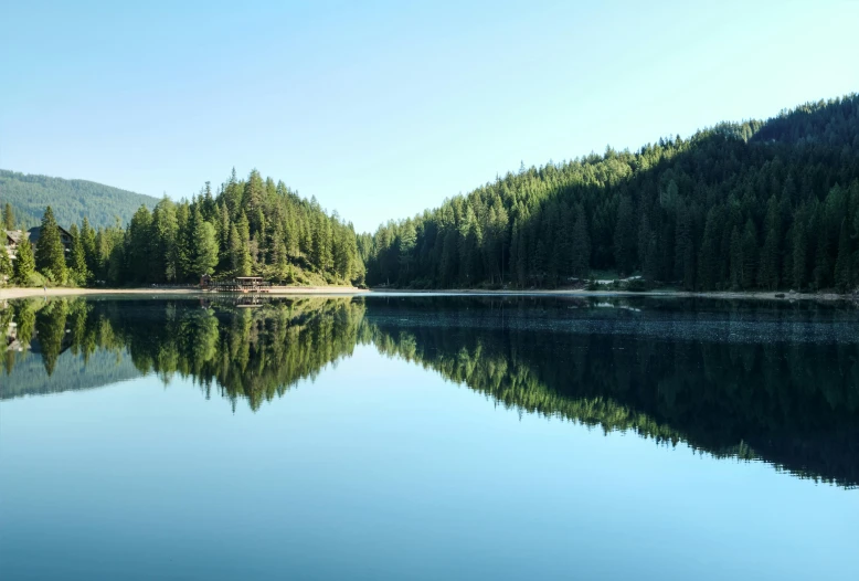 a large body of water surrounded by trees, by Jan Rustem, pexels contest winner, whistler, fan favorite, hd footage, italy