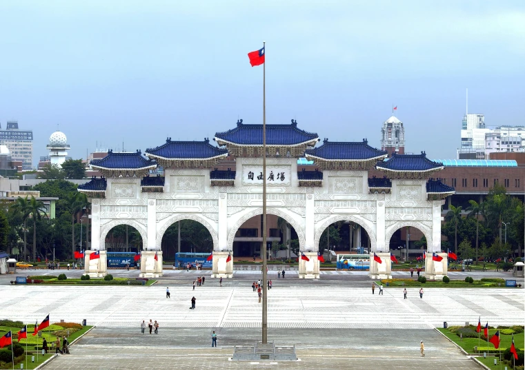 a large white building with a flag on top of it, inspired by Zhang Kechun, art nouveau, giant majestic archways, a park, lei min, square