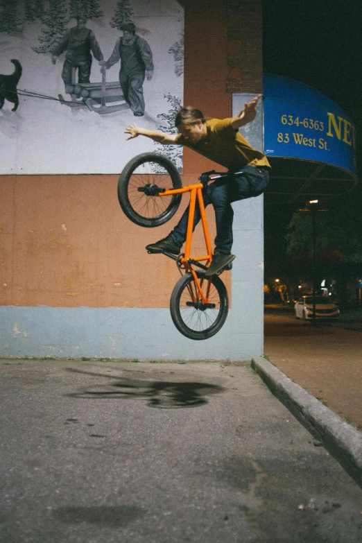 a man flying through the air while riding a bike, by Andrew Domachowski, gritty image, long hook nose, felix englund, sold on sukebannyc