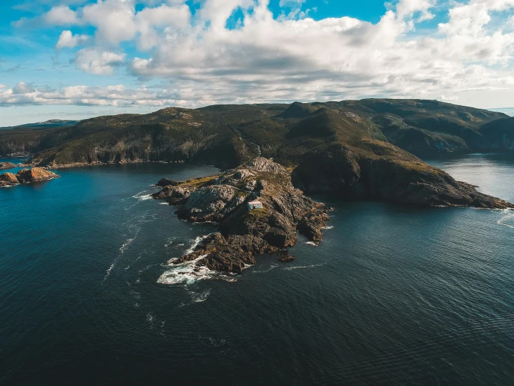 a small island in the middle of the ocean, pexels contest winner, picton blue, rocky coast, high quality photo, thumbnail