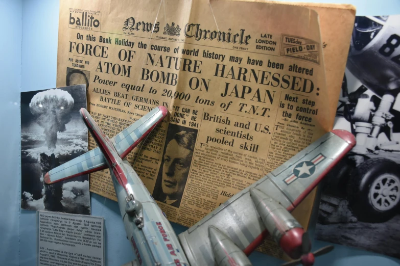 a model of a plane on display in a museum, by Jan Cox, retrofuturism, newspaper photograph, bombs are falling from the sky, detail shots, thumbnail