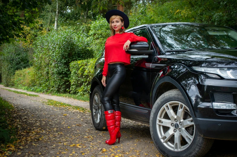 a woman standing next to a black suv, pexels contest winner, renaissance, red boots, irina nordsol kuzmina, avatar image, country style