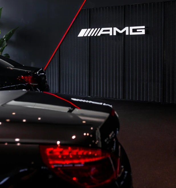 a couple of cars parked next to each other, by Sam Black, unsplash, conceptual art, sports car in the room, black show room, mercedez benz, red neon details