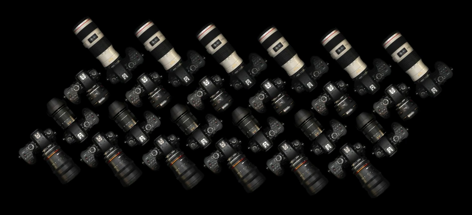 a group of cameras sitting next to each other, by Ejnar Nielsen, 4k photo gigapixel, on black background, stacked image, nikon d6